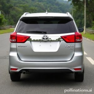 Toyota Kijang Innova bekas berwarna silver sedang melaju di jalanan pedesaan yang sedikit bergelombang, dikelilingi pepohonan hijau, menampilkan kesan tangguh dan siap untuk petualangan keluarga.